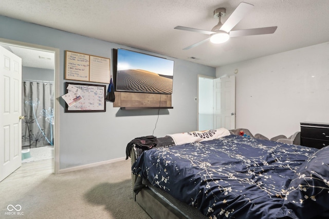 2887 Ludwig Dr, Indianapolis, IN 46239 - carpeted bedroom with a textured ceiling, ceiling fan, and baseboards