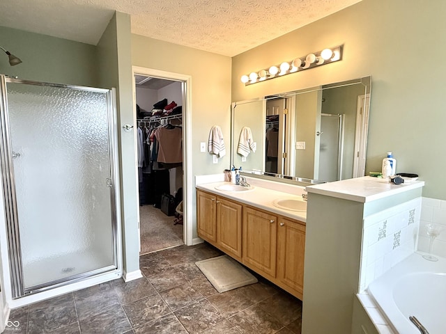 7042 Gavin Dr, Indianapolis, IN 46217 - bathroom featuring a spacious closet, a shower stall, double vanity, and a bath
