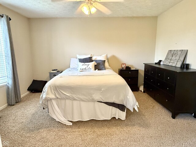 7042 Gavin Dr, Indianapolis, IN 46217 - bedroom featuring light carpet, a textured ceiling, and a ceiling fan