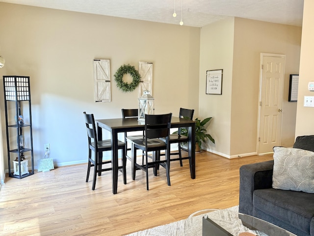 7042 Gavin Dr, Indianapolis, IN 46217 - dining area with light wood finished floors and baseboards