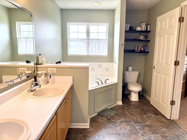 7042 Gavin Dr, Indianapolis, IN 46217 - full bath with a garden tub, double vanity, healthy amount of natural light, and a textured ceiling