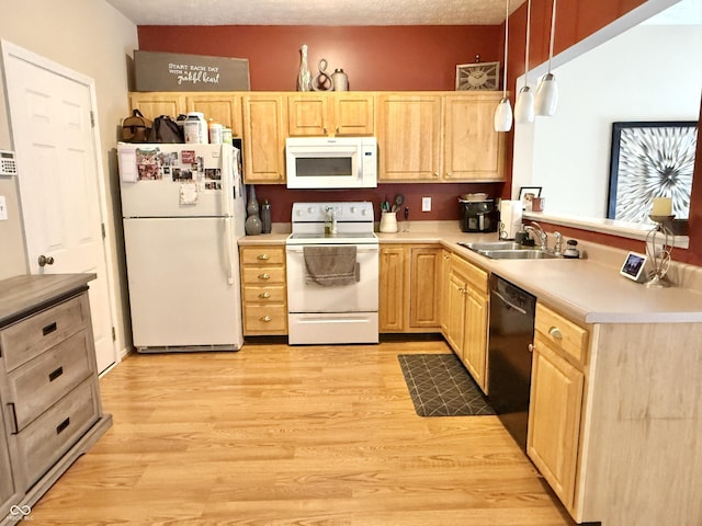7042 Gavin Dr, Indianapolis, IN 46217 - kitchen featuring white appliances, light brown cabinetry, a peninsula, light wood-type flooring, and light countertops