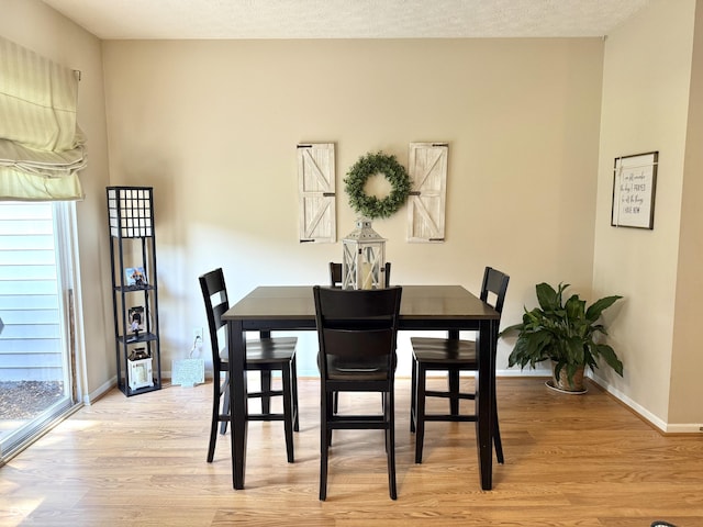 7042 Gavin Dr, Indianapolis, IN 46217 - dining room with light wood-style flooring