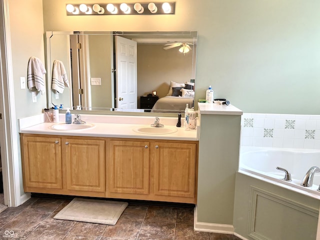 7042 Gavin Dr, Indianapolis, IN 46217 - full bath featuring double vanity, a garden tub, ensuite bath, and a ceiling fan