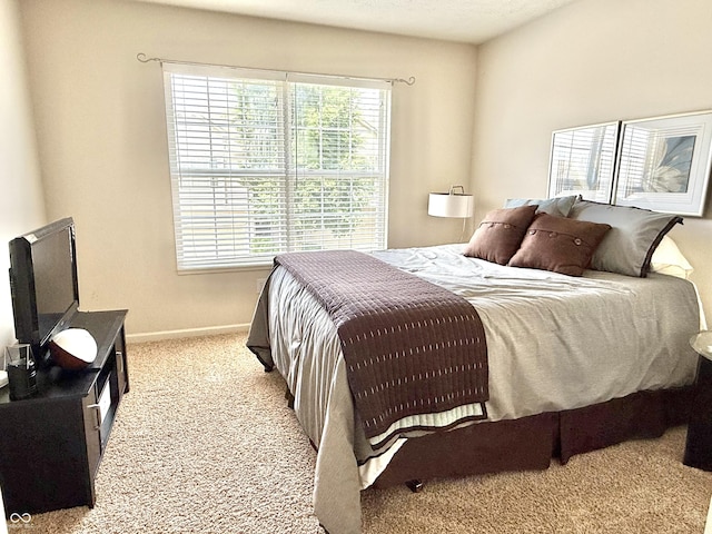 7042 Gavin Dr, Indianapolis, IN 46217 - carpeted bedroom featuring baseboards