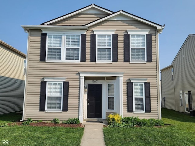 12671 Endurance Dr, Fishers, IN 46037 - view of front facade featuring a front yard and cooling unit