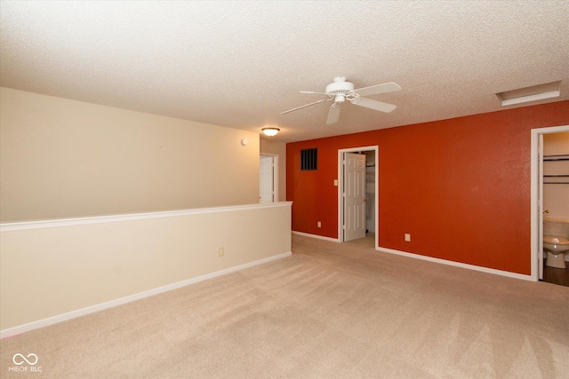 12671 Endurance Dr, Fishers, IN 46037 - spare room featuring carpet floors, a textured ceiling, attic access, ceiling fan, and baseboards