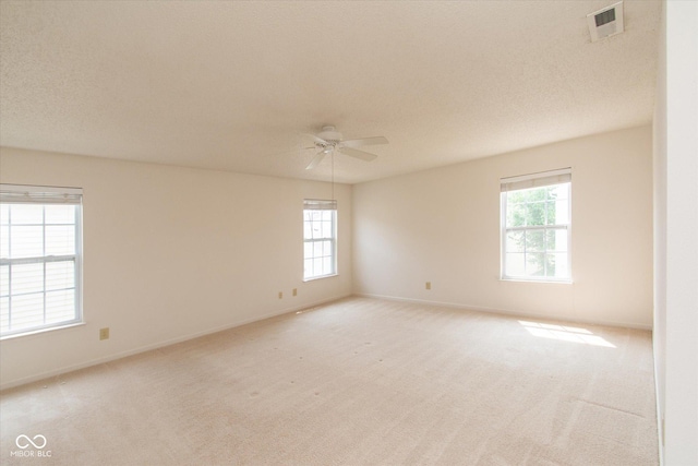 12671 Endurance Dr, Fishers, IN 46037 - unfurnished room with plenty of natural light, a ceiling fan, and light colored carpet