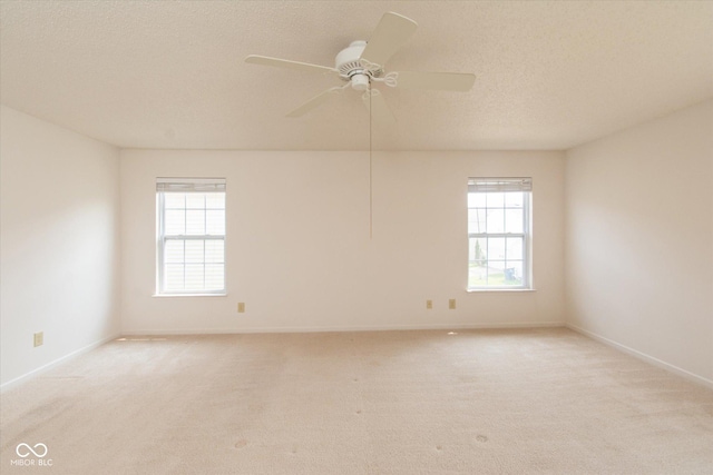 12671 Endurance Dr, Fishers, IN 46037 - unfurnished room featuring light colored carpet, baseboards, a textured ceiling, and ceiling fan