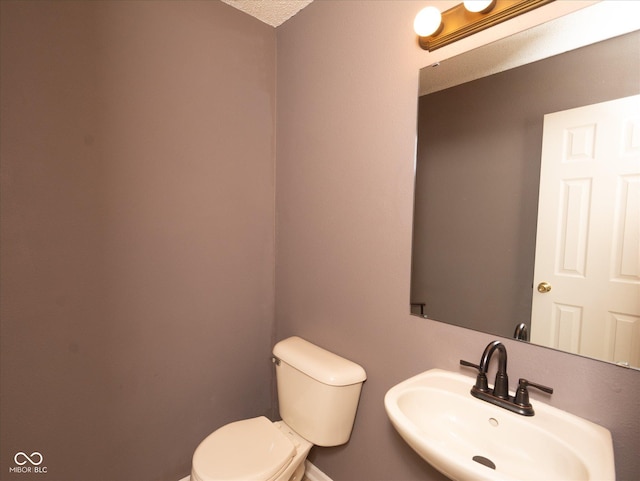 12671 Endurance Dr, Fishers, IN 46037 - bathroom featuring toilet, a sink, and baseboards