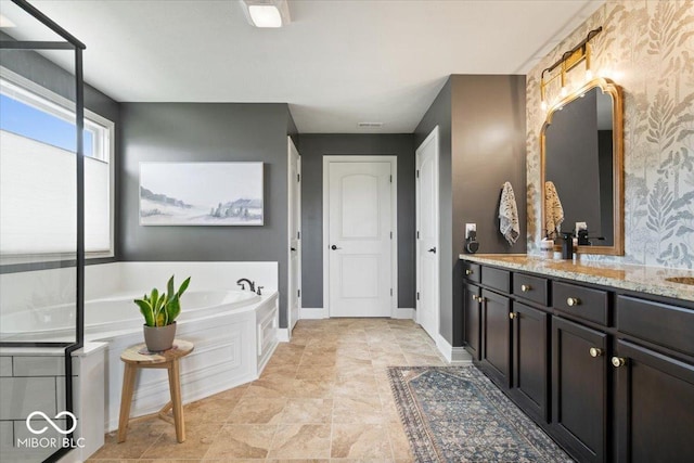 10054 Win Star Way, Fishers, IN 46040 - full bath featuring a garden tub, vanity, baseboards, and wallpapered walls