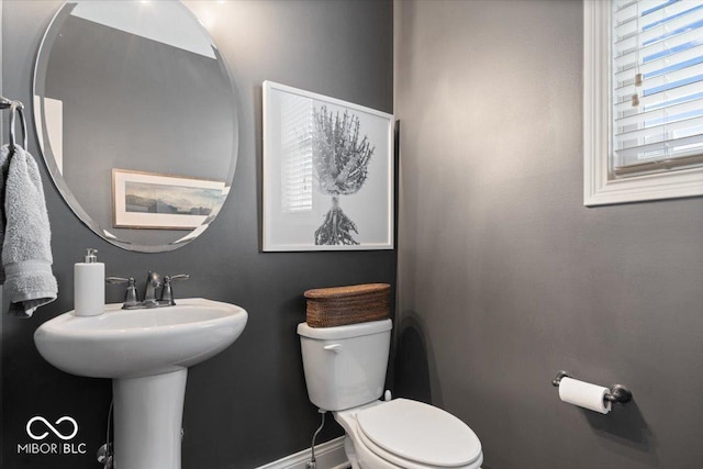 10054 Win Star Way, Fishers, IN 46040 - bathroom featuring toilet, baseboards, and a sink