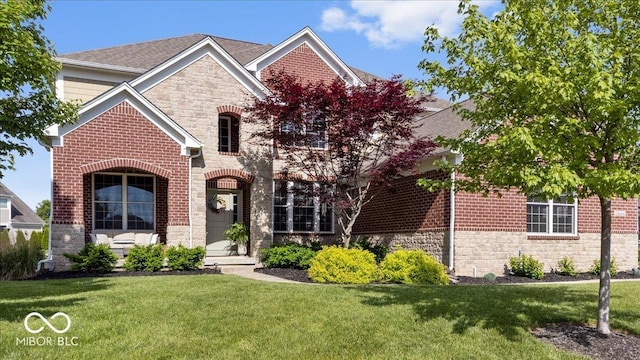 10054 Win Star Way, Fishers, IN 46040 - view of front facade with stone siding, a front lawn, brick siding, and roof with shingles