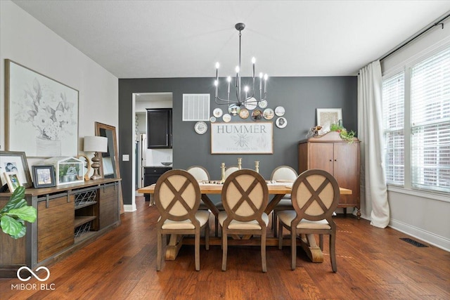 10054 Win Star Way, Fishers, IN 46040 - dining area featuring a chandelier, baseboards, and dark wood-style flooring