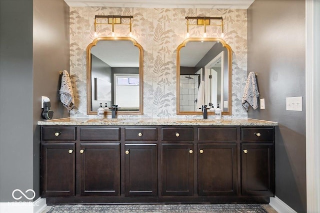 10054 Win Star Way, Fishers, IN 46040 - bathroom featuring double vanity, wallpapered walls, and baseboards