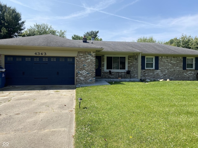 4343 W Fairview Rd, Greenwood, IN 46142 - single story home featuring driveway, brick siding, an attached garage, and a front lawn