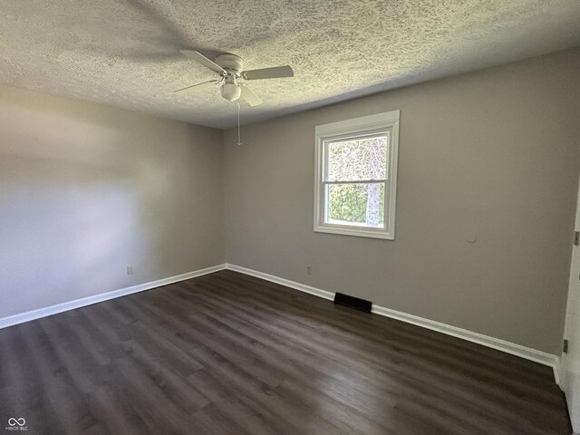4343 W Fairview Rd, Greenwood, IN 46142 - empty room with a textured ceiling, ceiling fan, and dark wood-type flooring