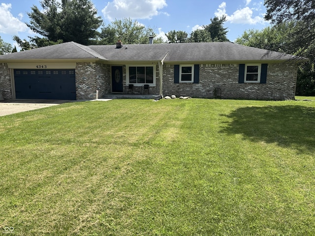 4343 W Fairview Rd, Greenwood, IN 46142 - ranch-style home with brick siding, a garage, a front yard, and driveway