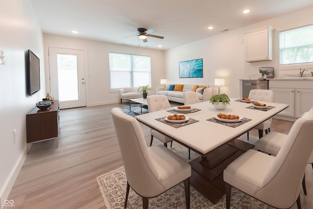 1452 Coen Ct, Columbus, IN 47201 - dining area with light wood-style flooring, a ceiling fan, baseboards, and recessed lighting