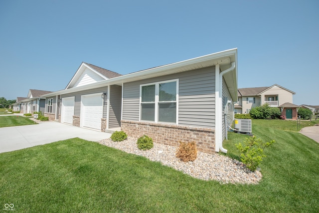 1452 Coen Ct, Columbus, IN 47201 - view of front of house with a garage, driveway, a front lawn, central air condition unit, and brick siding