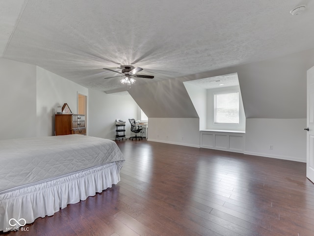 730 N Forsythe St, Franklin, IN 46131 - bedroom featuring dark wood-type flooring, lofted ceiling, baseboards, a ceiling fan, and a textured ceiling