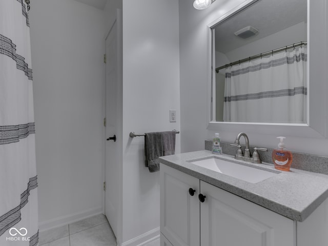 730 N Forsythe St, Franklin, IN 46131 - full bathroom featuring vanity, tile patterned floors, and baseboards