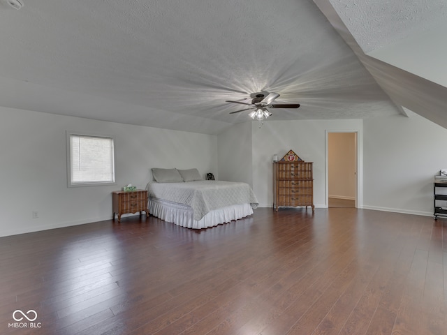 730 N Forsythe St, Franklin, IN 46131 - bedroom with a textured ceiling, dark wood-style flooring, vaulted ceiling, baseboards, and ceiling fan