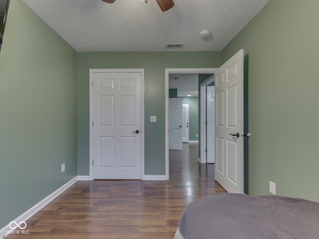 730 N Forsythe St, Franklin, IN 46131 - bedroom featuring wood finished floors, baseboards, a textured ceiling, and ceiling fan