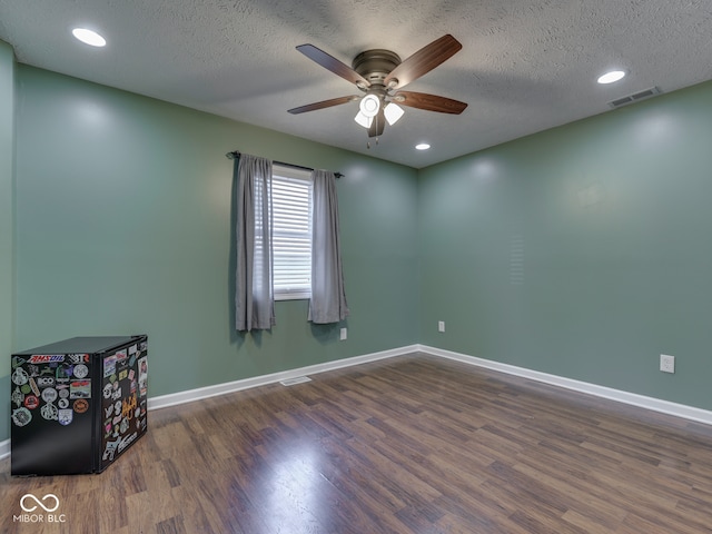 730 N Forsythe St, Franklin, IN 46131 - empty room with a ceiling fan, wood finished floors, baseboards, a textured ceiling, and recessed lighting
