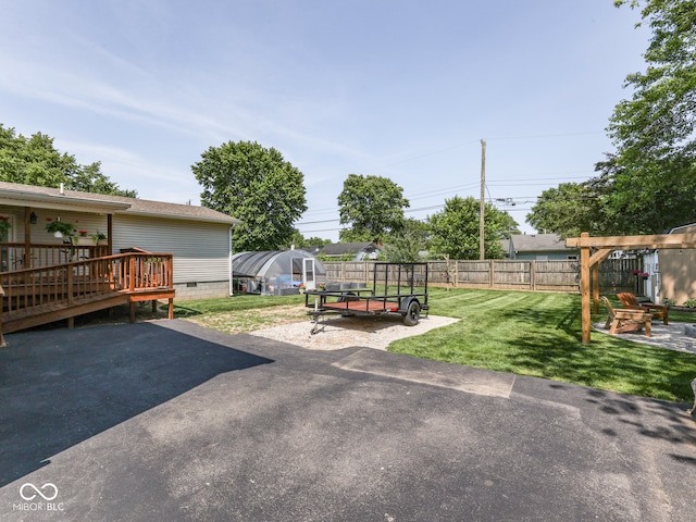 730 N Forsythe St, Franklin, IN 46131 - view of yard featuring a greenhouse, a patio, a wooden deck, and an outdoor structure