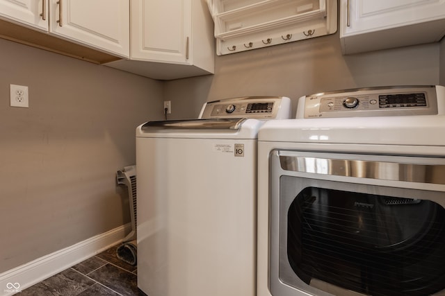 2016 Central Ave, Indianapolis, IN 46202 - washroom featuring baseboards, washer and dryer, and cabinet space