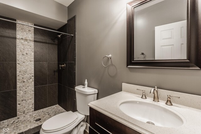 2016 Central Ave, Indianapolis, IN 46202 - bathroom featuring toilet, vanity, and tiled shower