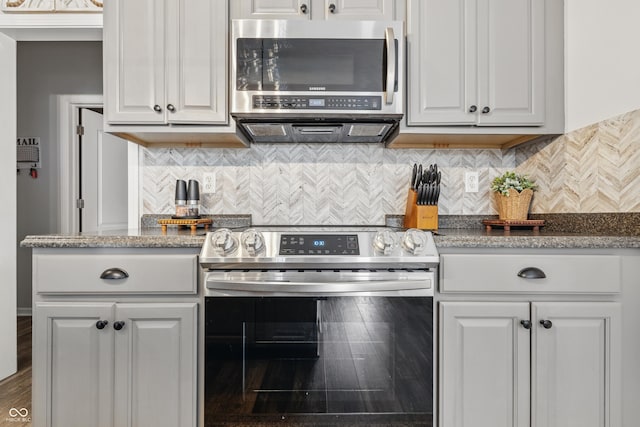 5030 E 800 N, Columbus, IN 47203 - kitchen with appliances with stainless steel finishes, white cabinetry, and tasteful backsplash
