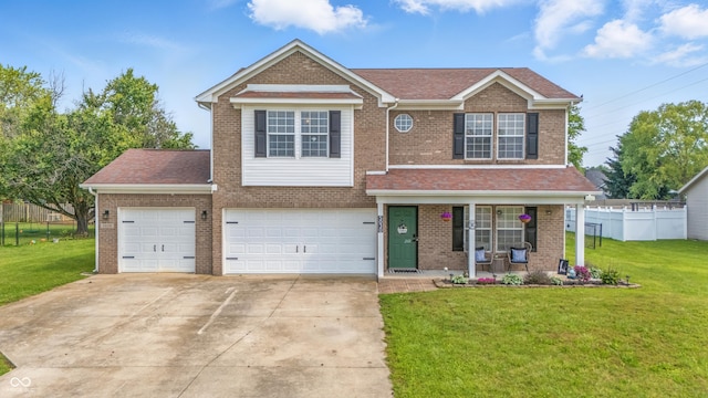 5030 E 800 N, Columbus, IN 47203 - view of front of property with brick siding, covered porch, and concrete driveway