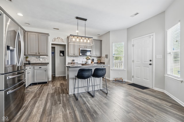 5030 E 800 N, Columbus, IN 47203 - kitchen with appliances with stainless steel finishes, gray cabinetry, backsplash, dark wood-type flooring, and recessed lighting