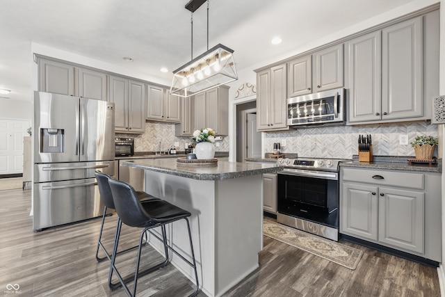 5030 E 800 N, Columbus, IN 47203 - kitchen with stainless steel appliances, gray cabinets, a center island, dark wood-type flooring, and recessed lighting