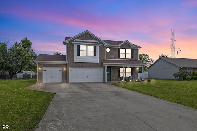 5030 E 800 N, Columbus, IN 47203 - traditional home featuring brick siding, driveway, covered porch, and an attached garage