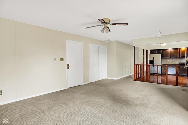 13172 E 116th St, Fishers, IN 46037 - unfurnished living room with a ceiling fan, carpet floors, and baseboards