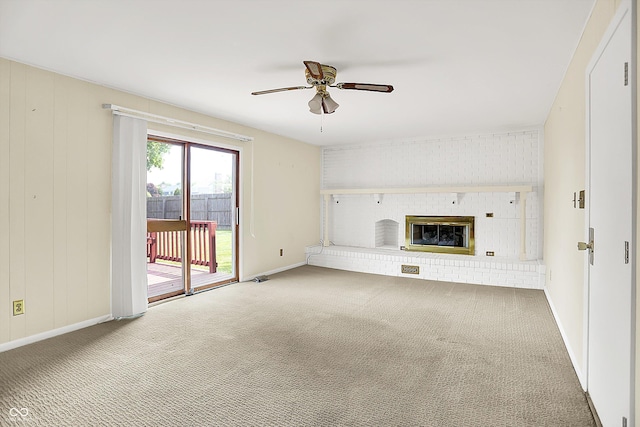 13172 E 116th St, Fishers, IN 46037 - unfurnished living room with ceiling fan, a fireplace, carpet flooring, and baseboards