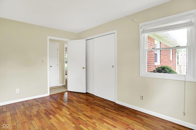 13172 E 116th St, Fishers, IN 46037 - unfurnished bedroom with hardwood / wood-style floors, baseboards, and a closet
