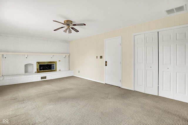 13172 E 116th St, Fishers, IN 46037 - unfurnished living room featuring ceiling fan, carpet floors, a brick fireplace, and baseboards