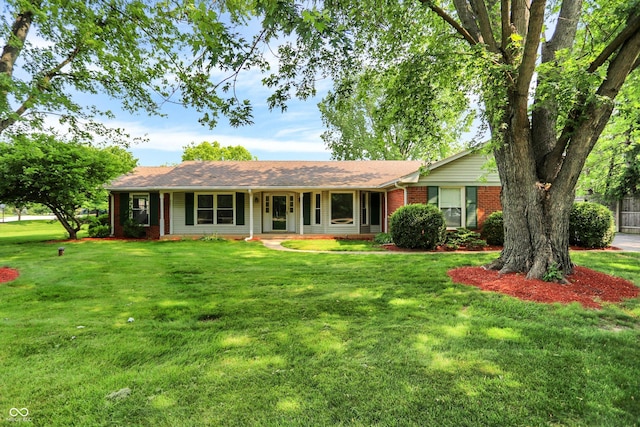 13172 E 116th St, Fishers, IN 46037 - ranch-style home featuring brick siding, a front yard, and covered porch