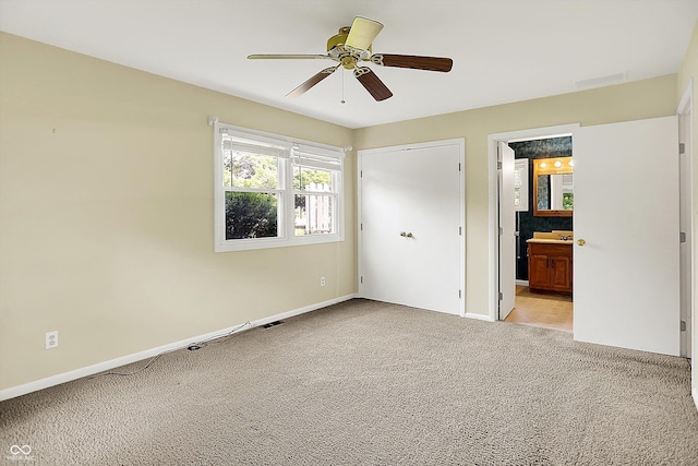13172 E 116th St, Fishers, IN 46037 - unfurnished bedroom featuring light carpet, baseboards, ensuite bath, and a ceiling fan