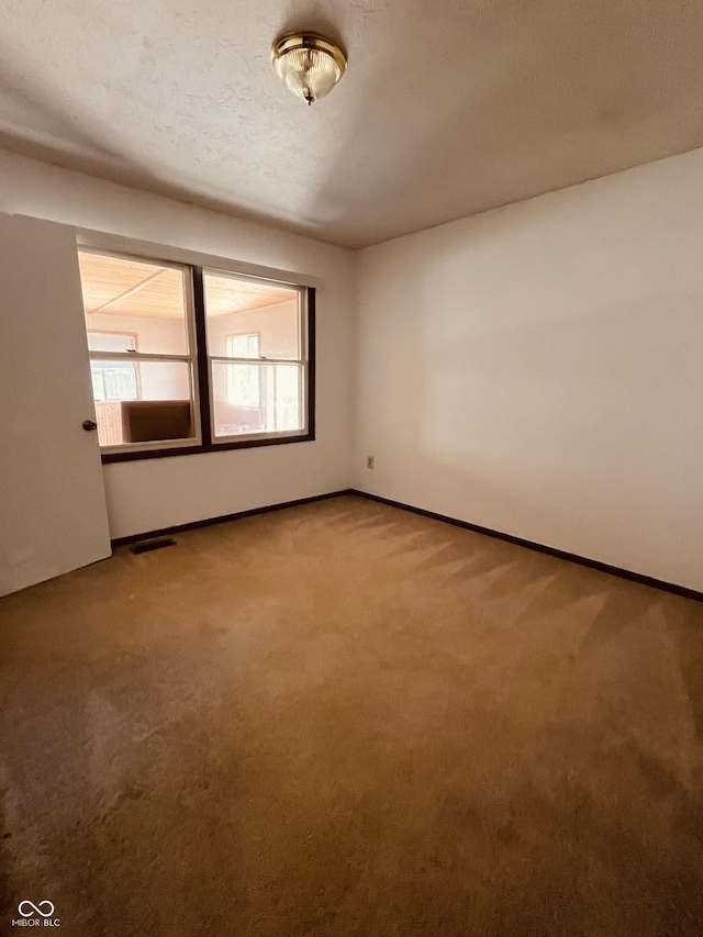 514 W 6th St, Sheridan, IN 46069 - carpeted empty room with baseboards