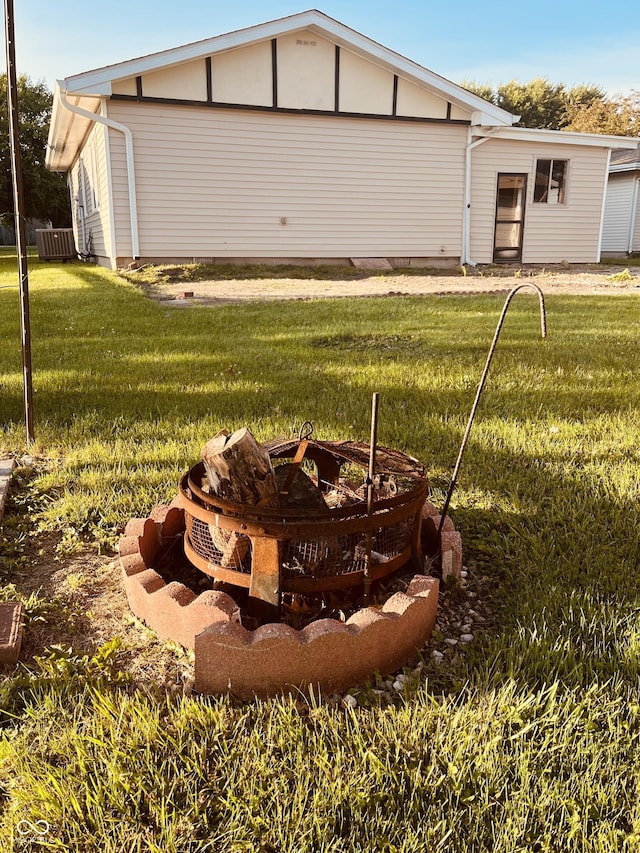 514 W 6th St, Sheridan, IN 46069 - back of property featuring an outdoor fire pit and a lawn