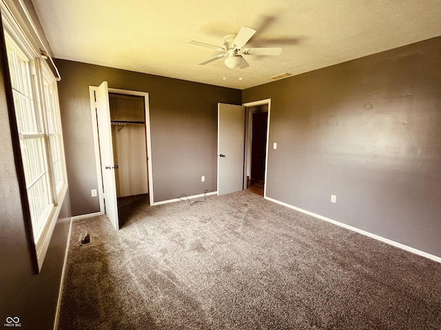514 W 6th St, Sheridan, IN 46069 - unfurnished bedroom featuring carpet flooring, a closet, baseboards, and a ceiling fan