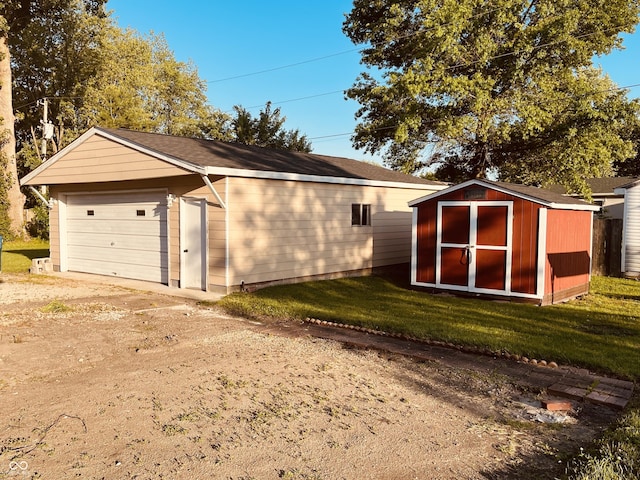 514 W 6th St, Sheridan, IN 46069 - detached garage featuring driveway and a storage shed