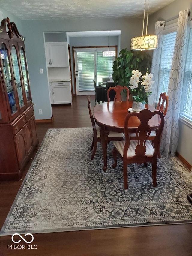 1322 Greenway Dr, Anderson, IN 46011 - dining room with dark wood-style flooring and baseboards