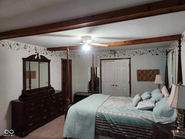 1322 Greenway Dr, Anderson, IN 46011 - carpeted bedroom with beamed ceiling, a ceiling fan, and a closet