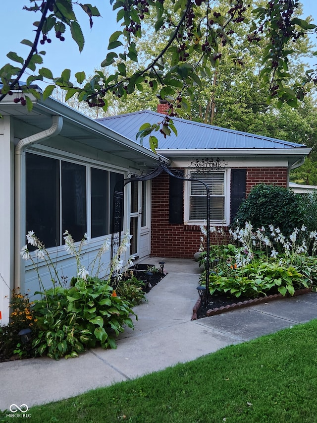 1322 Greenway Dr, Anderson, IN 46011 - property entrance featuring brick siding and metal roof